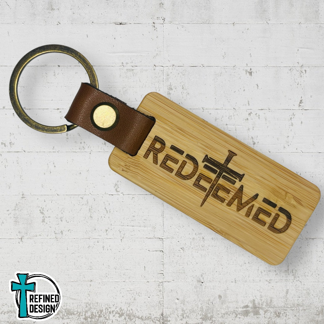 “Redeemed Nail Cross” Wood and Leather Keychain